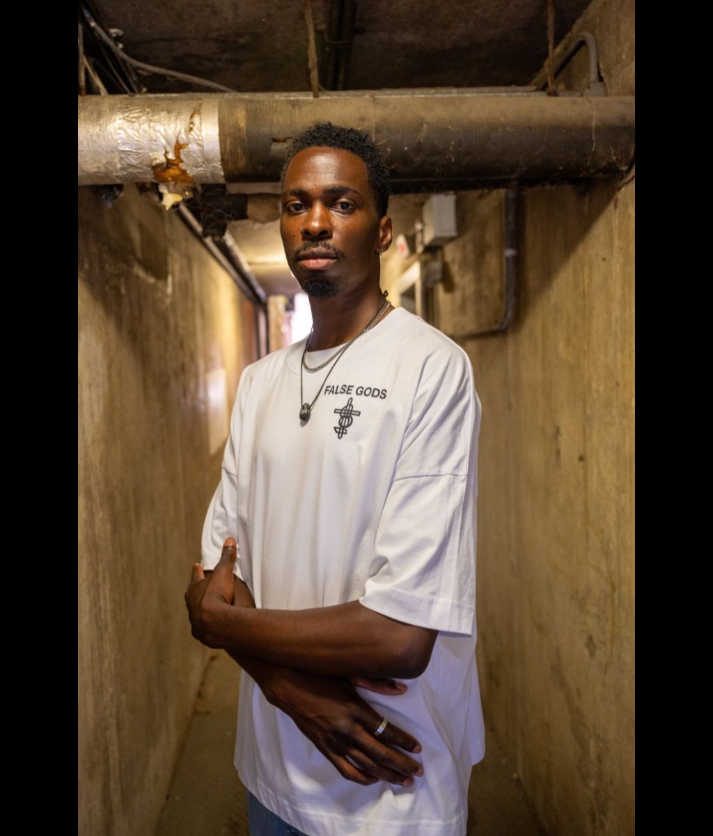 Male model wearing Men's Bold Spirit Black Oversized T-Shirt - Front view
